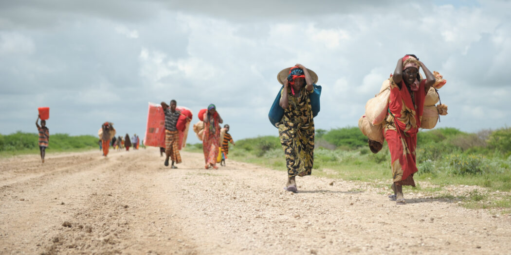 Sub-saharan migrant women carrying what they can UN