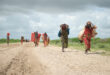 Sub-saharan migrant women carrying what they can UN