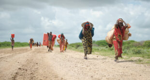 Sub-saharan migrant women carrying what they can UN